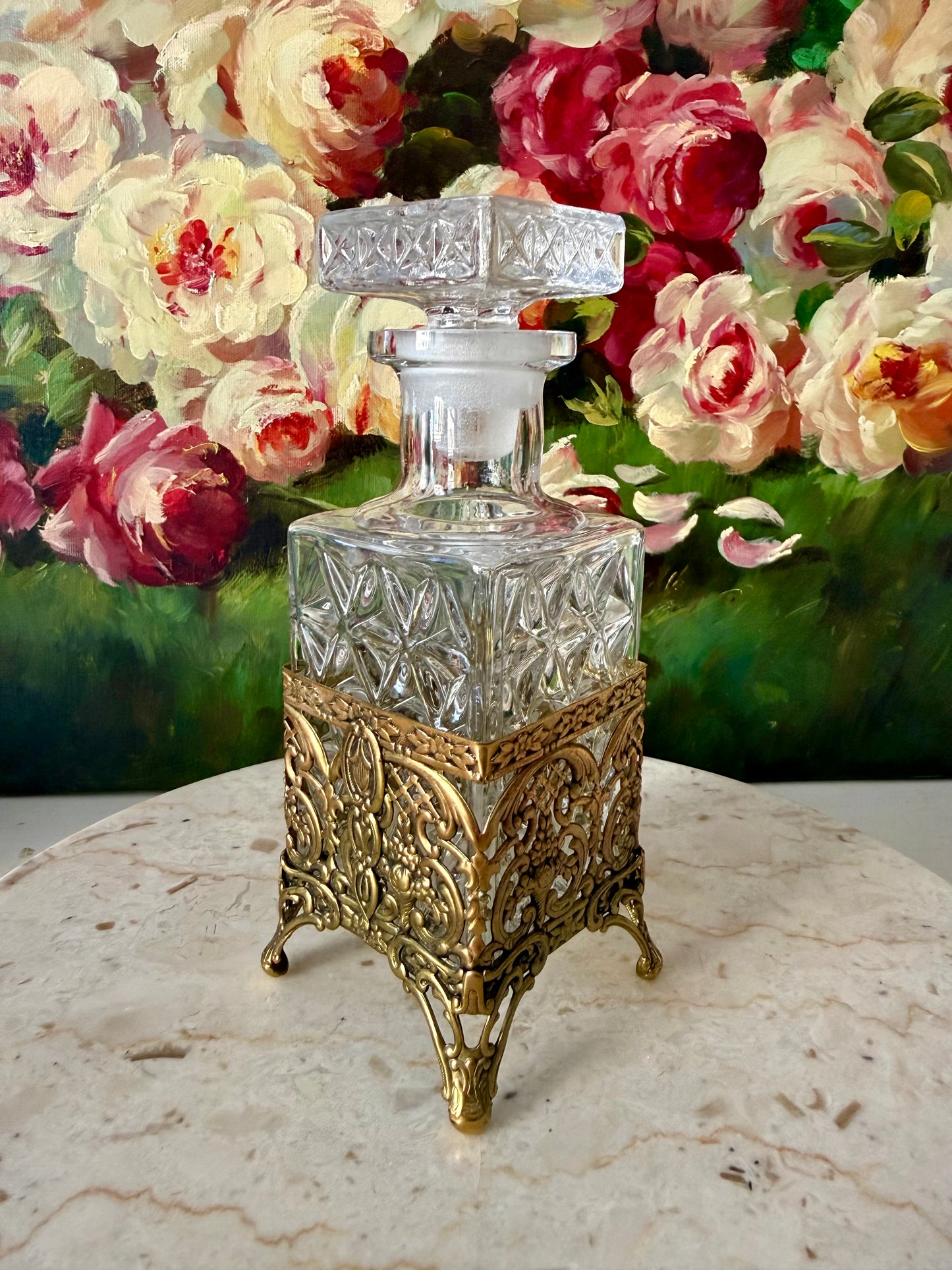 Antique Style Hollywood Regency Perfume Bottle features an Ornate Gold-plated Filigree Holder