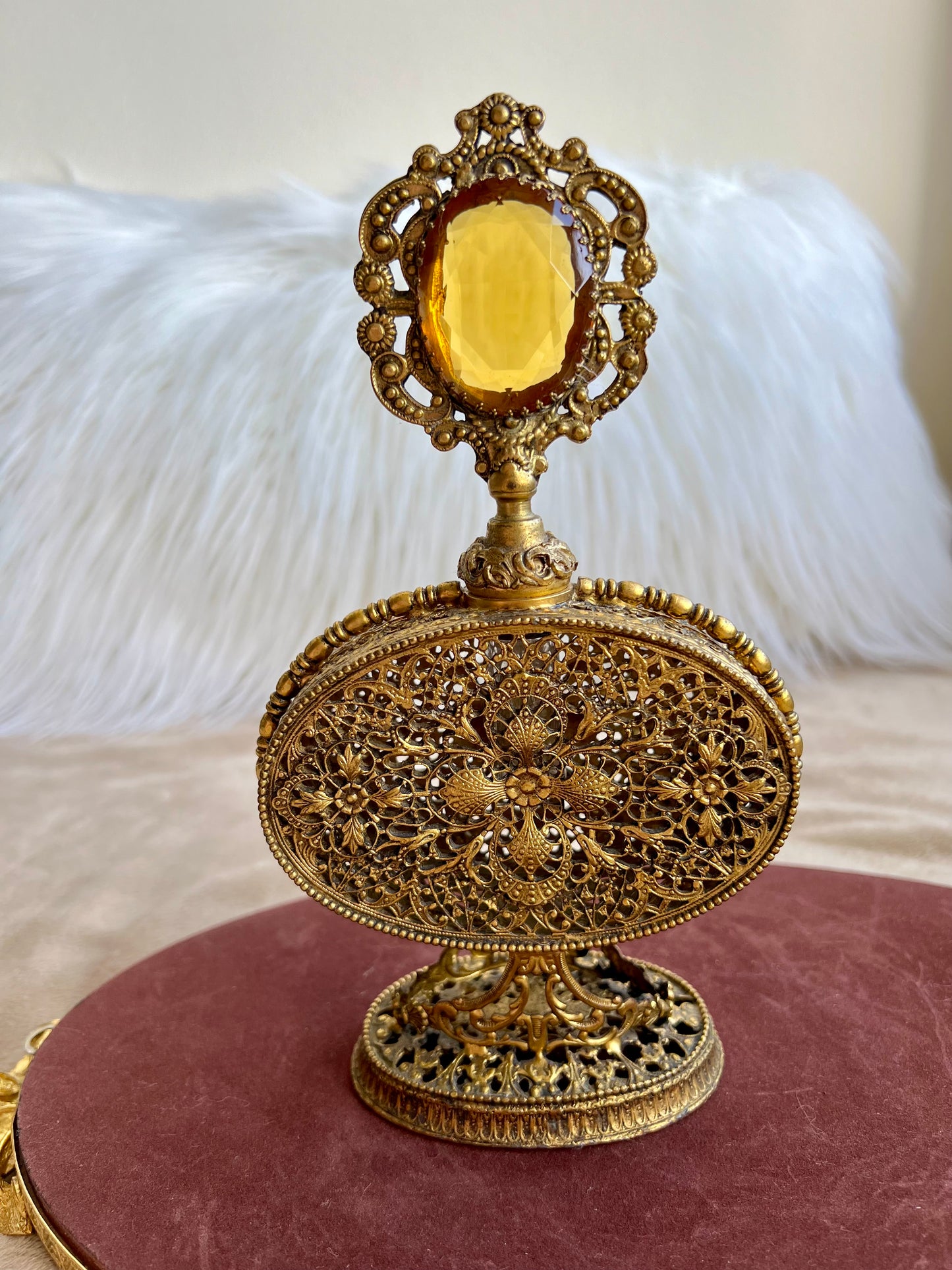 1950s or 1960s Hollywood Regency Style Vintage Ormolu Filigree Gilded Brass Perfume Bottle with a Large Yellow Rhinestone on the Top