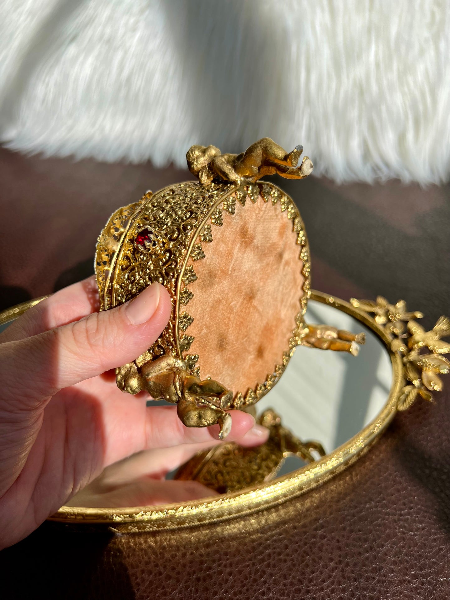 Three Footed Cherub Round Vintage Design Jewelry Casket/ Box with Pink Plush on the Top and Inside & Burgundy Red Stones Decoration