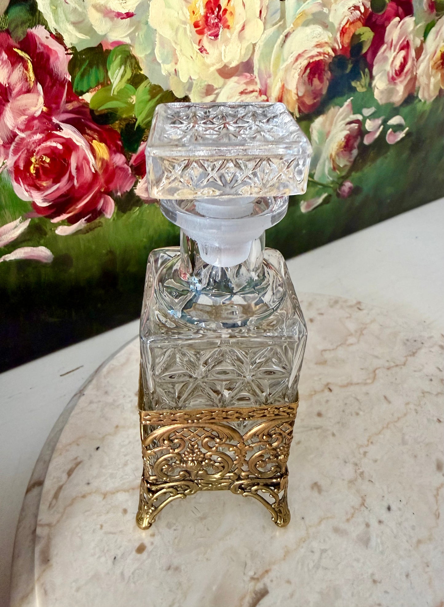 Antique Style Hollywood Regency Perfume Bottle features an Ornate Gold-plated Filigree Holder