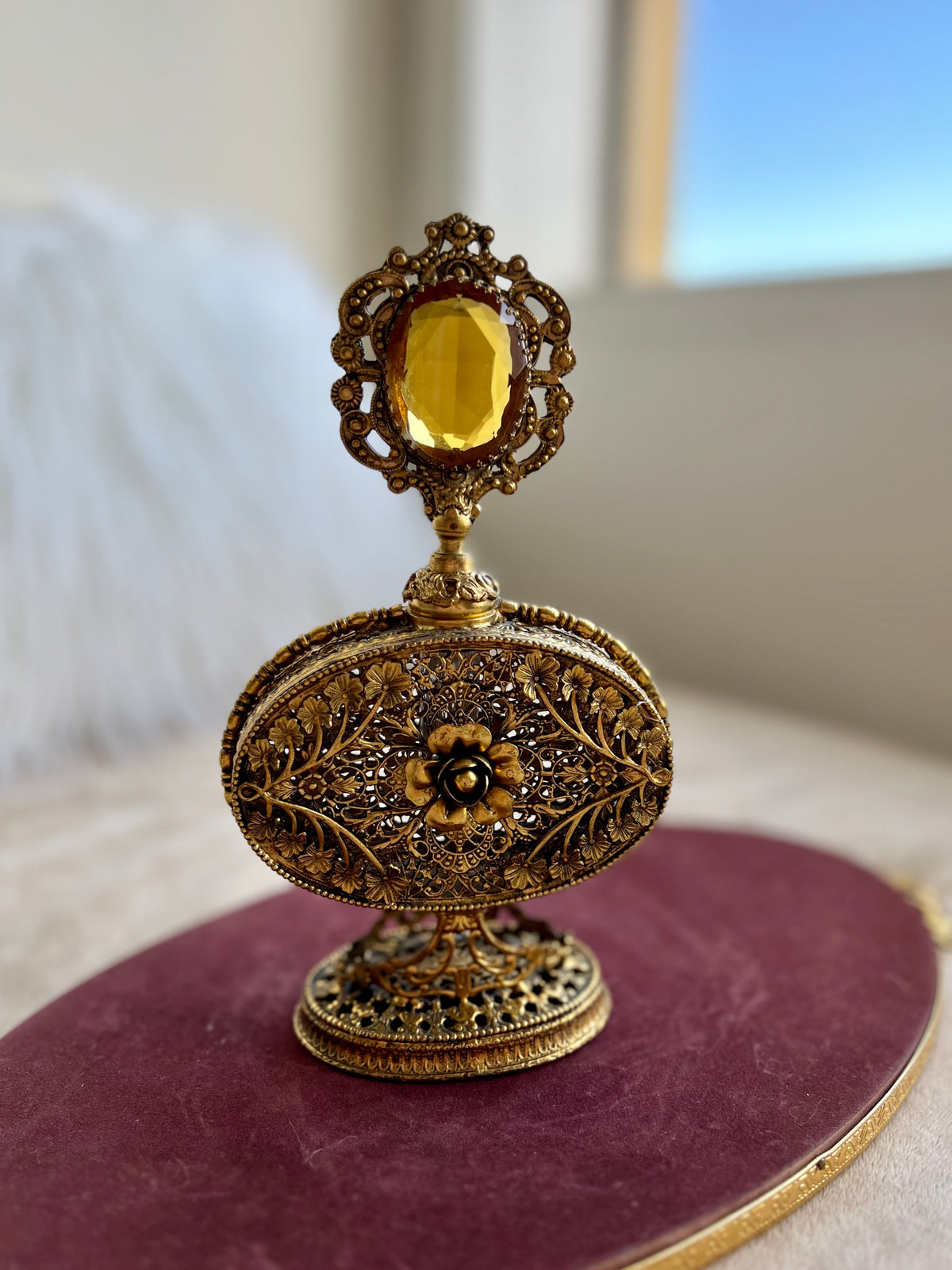 1950s or 1960s Hollywood Regency Style Vintage Ormolu Filigree Gilded Brass Perfume Bottle with a Large Yellow Rhinestone on the Top