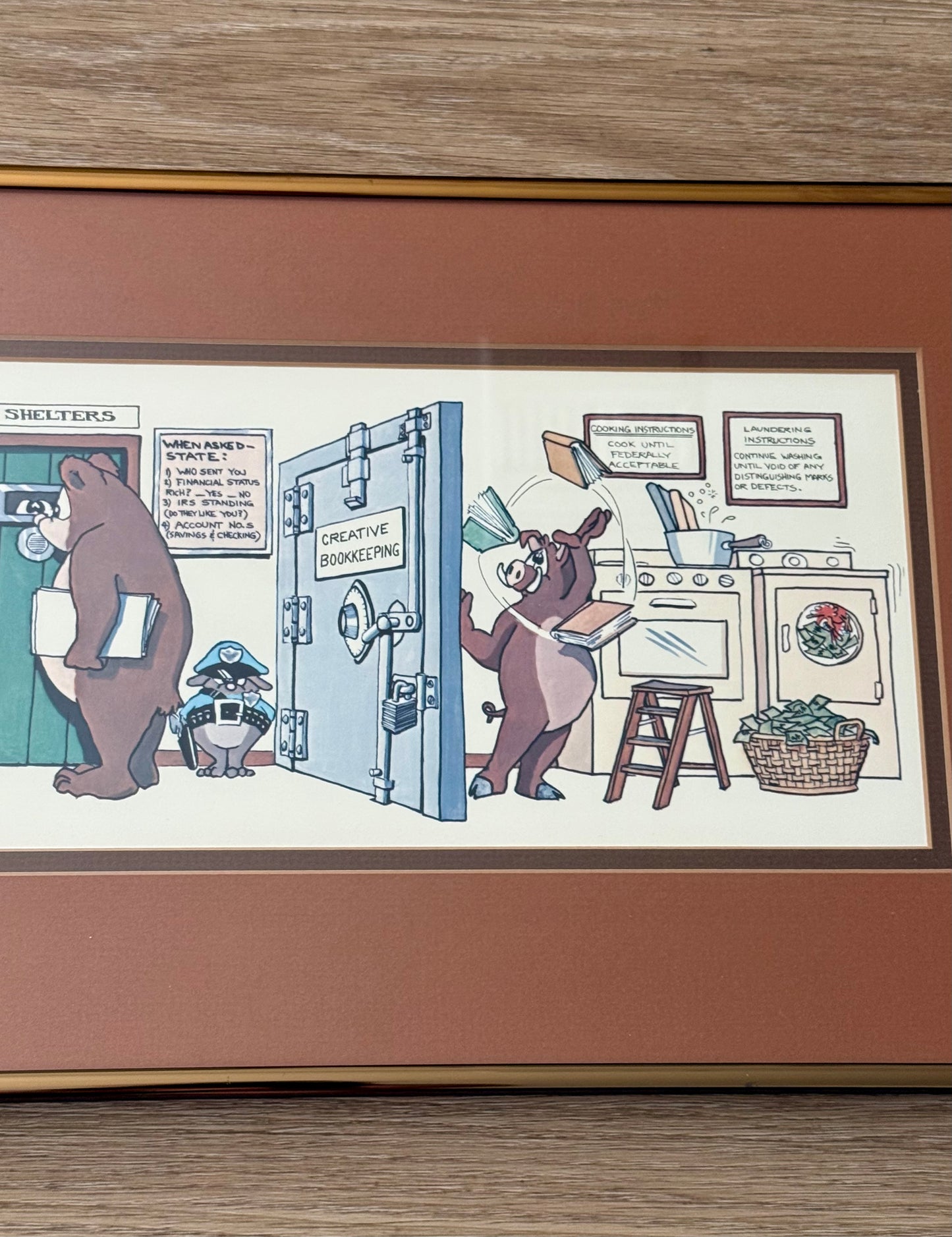 Vintage Framed Cartoon Artwork is titled “Financial Planners”, Signed and Numbered by Robert Marble in 1982 - 50/750