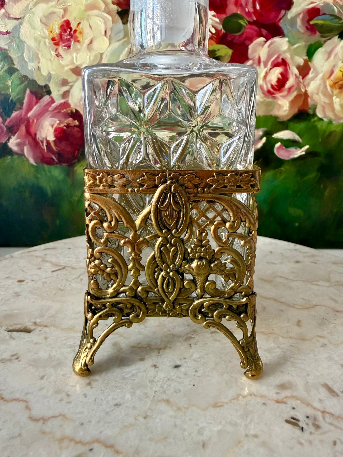 Antique Style Hollywood Regency Perfume Bottle features an Ornate Gold-plated Filigree Holder