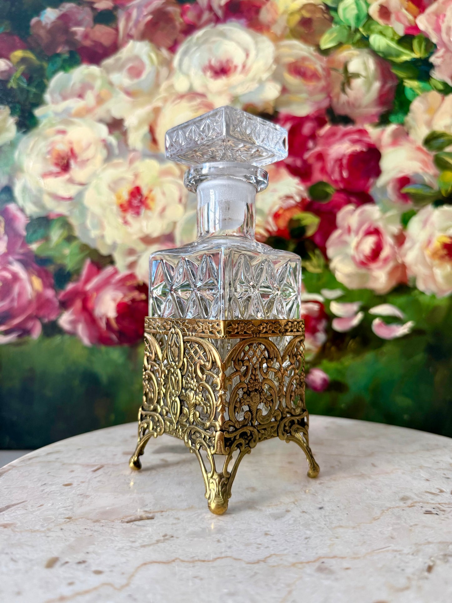 Antique Style Hollywood Regency Perfume Bottle features an Ornate Gold-plated Filigree Holder