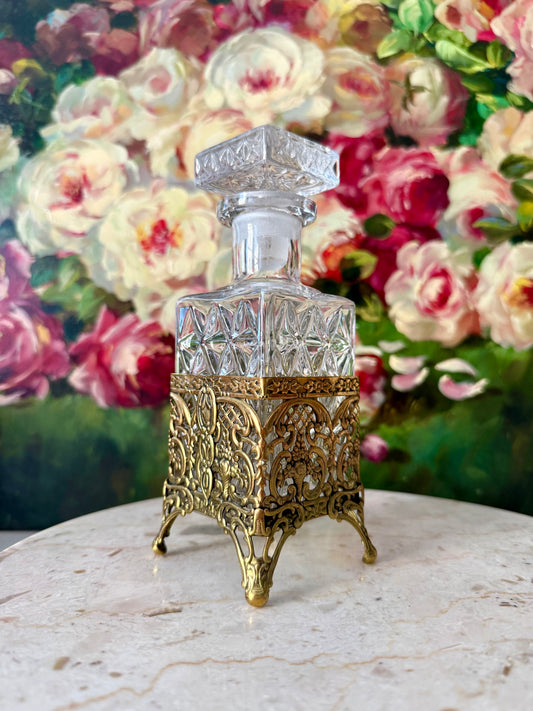 Antique Style Hollywood Regency Perfume Bottle features an Ornate Gold-plated Filigree Holder