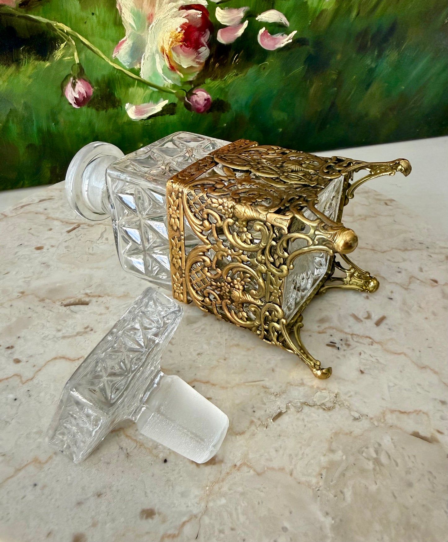 Antique Style Hollywood Regency Perfume Bottle features an Ornate Gold-plated Filigree Holder