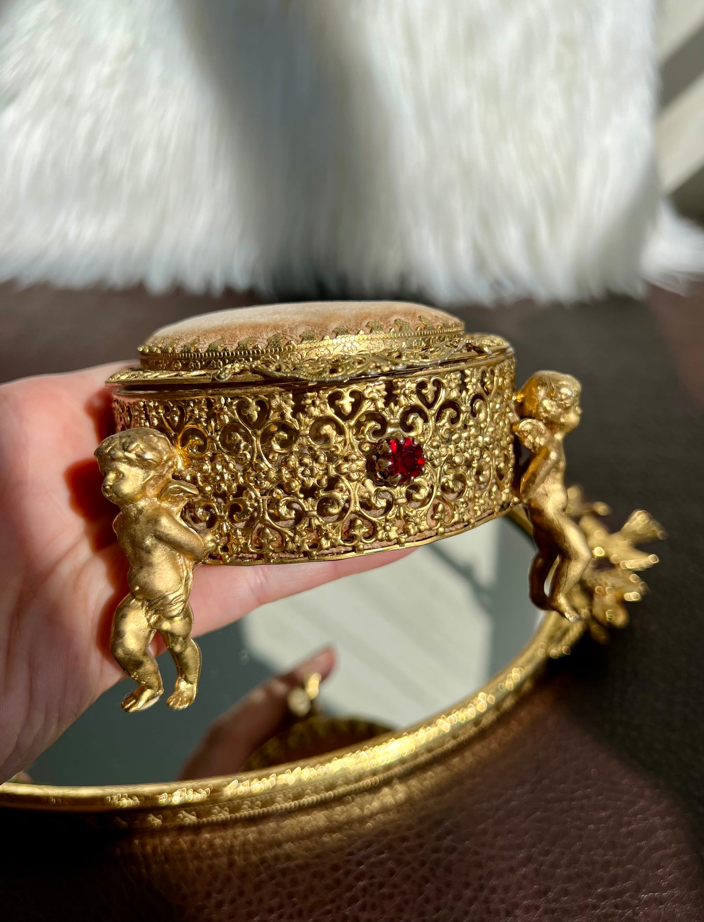 Three Footed Cherub Round Vintage Design Jewelry Casket/ Box with Pink Plush on the Top and Inside & Burgundy Red Stones Decoration