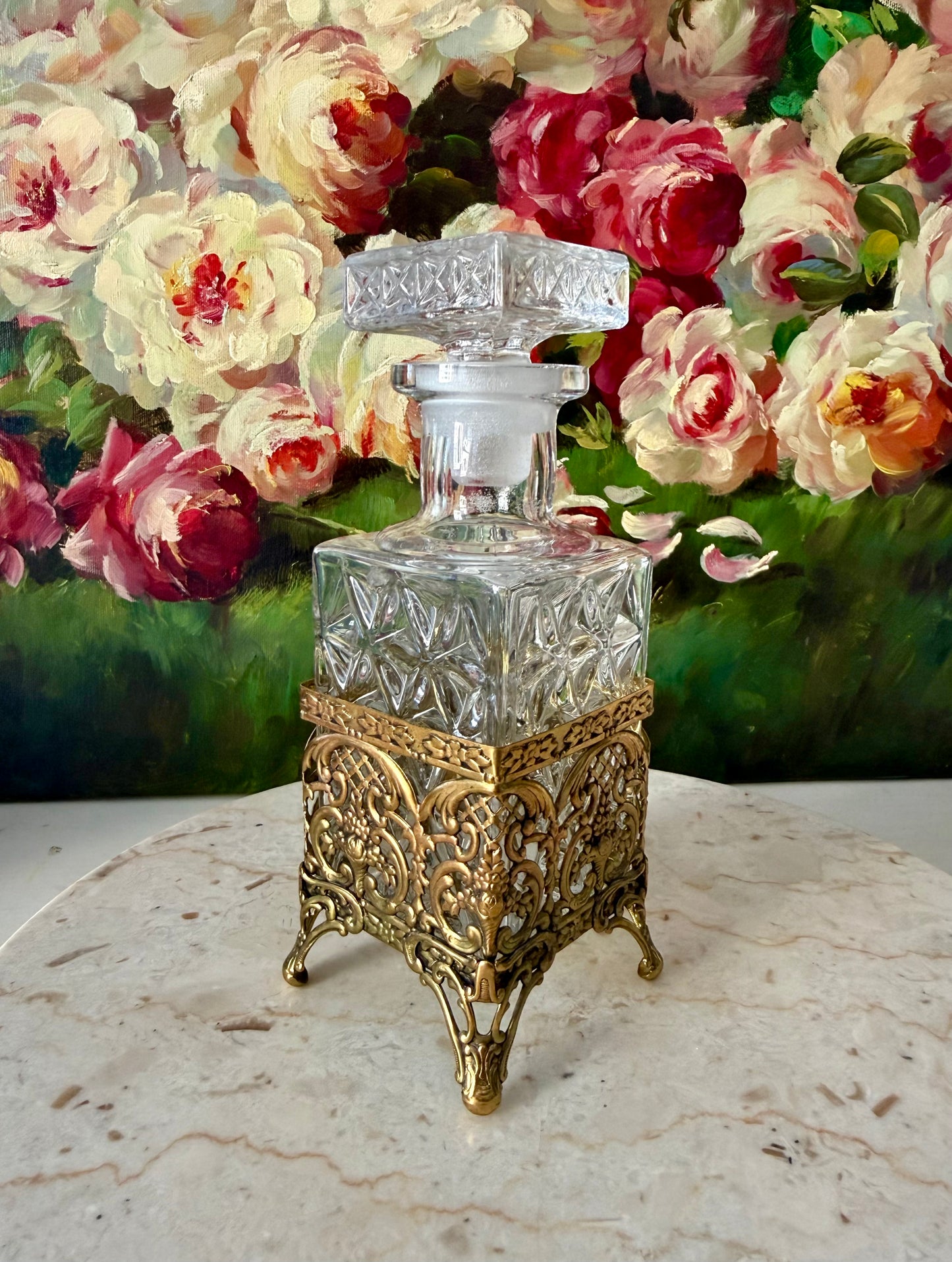 Antique Style Hollywood Regency Perfume Bottle features an Ornate Gold-plated Filigree Holder