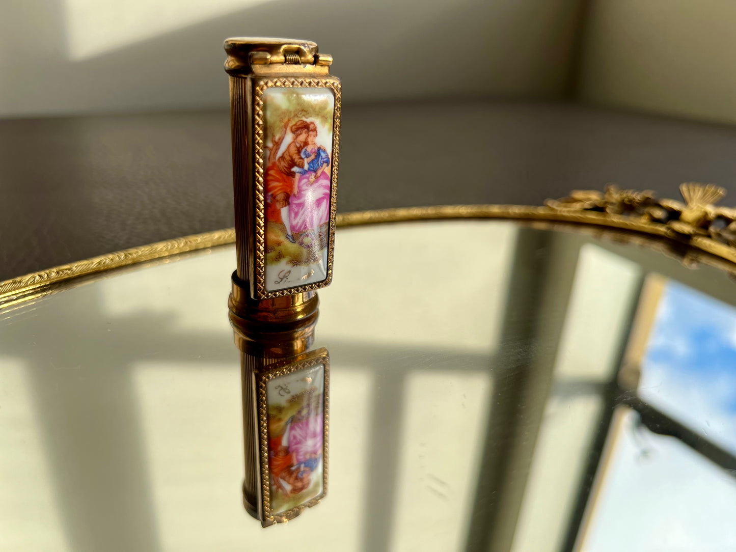 Limoges porcelain and gilded metal lipstick case with mirror