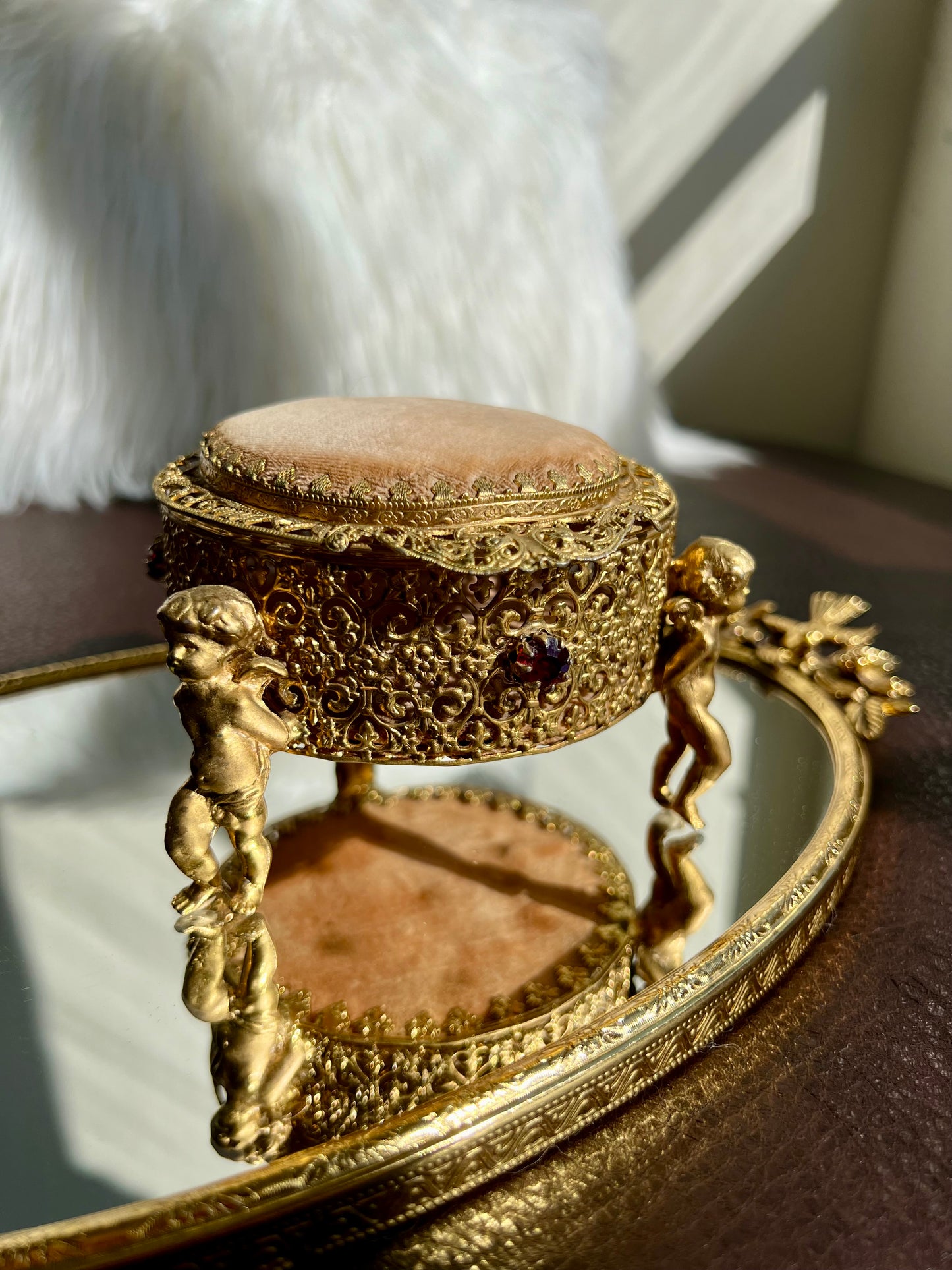 Three Footed Cherub Round Vintage Design Jewelry Casket/ Box with Pink Plush on the Top and Inside & Burgundy Red Stones Decoration