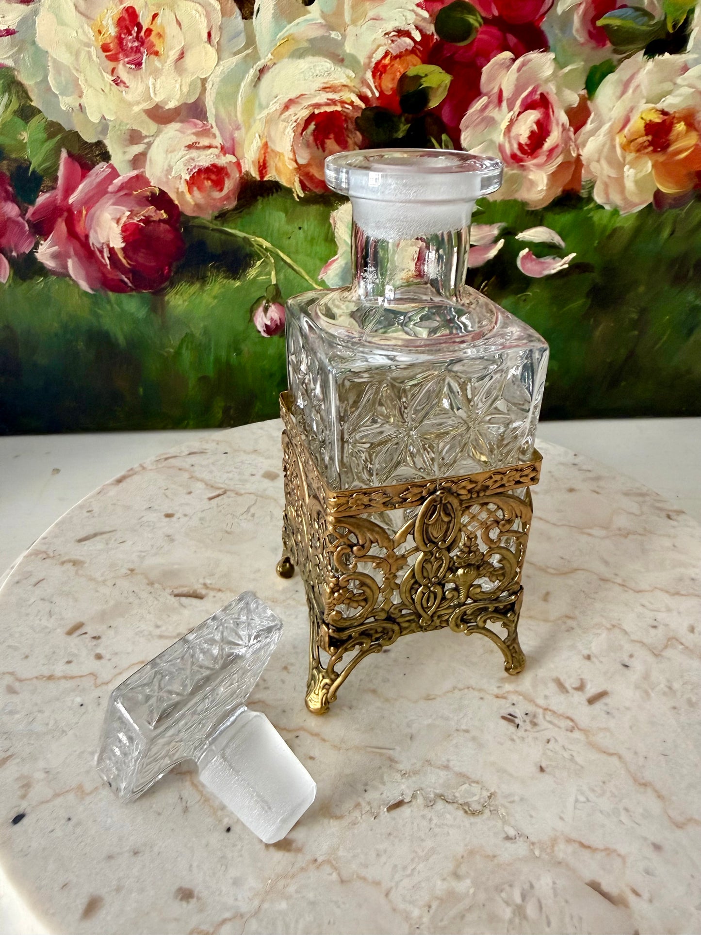 Antique Style Hollywood Regency Perfume Bottle features an Ornate Gold-plated Filigree Holder