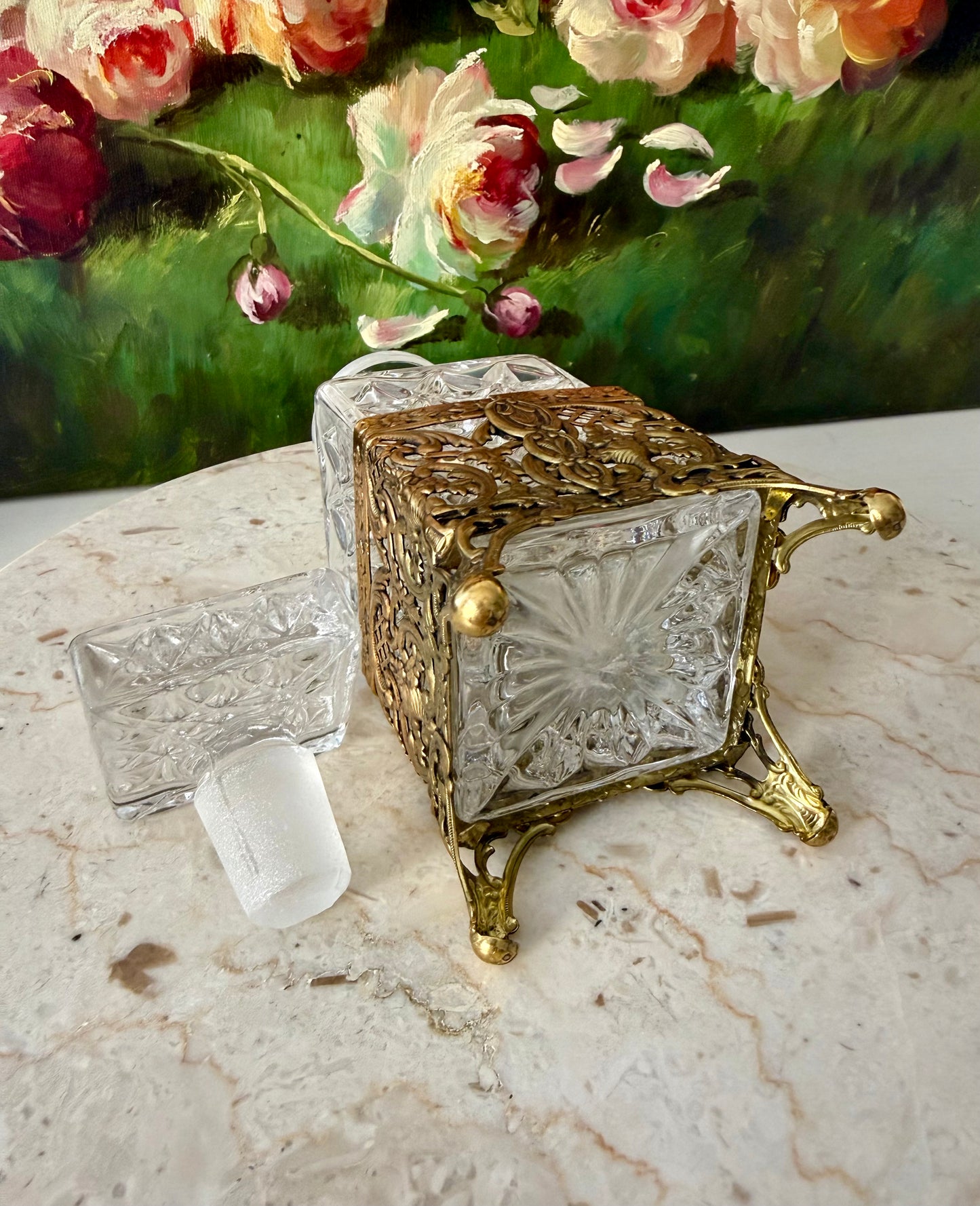 Antique Style Hollywood Regency Perfume Bottle features an Ornate Gold-plated Filigree Holder