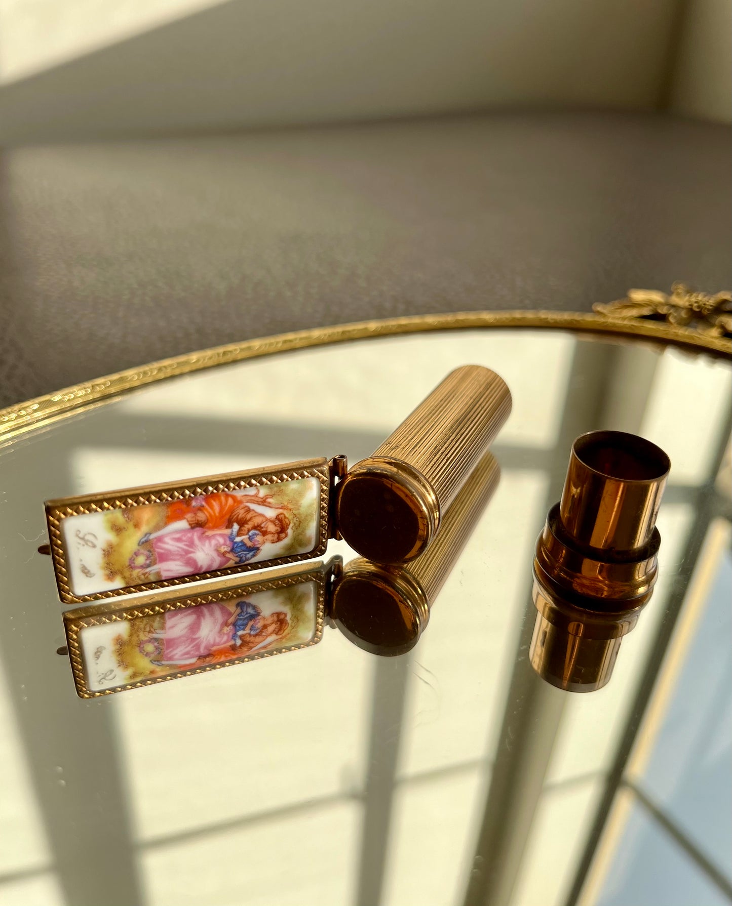 Limoges porcelain and gilded metal lipstick case with mirror