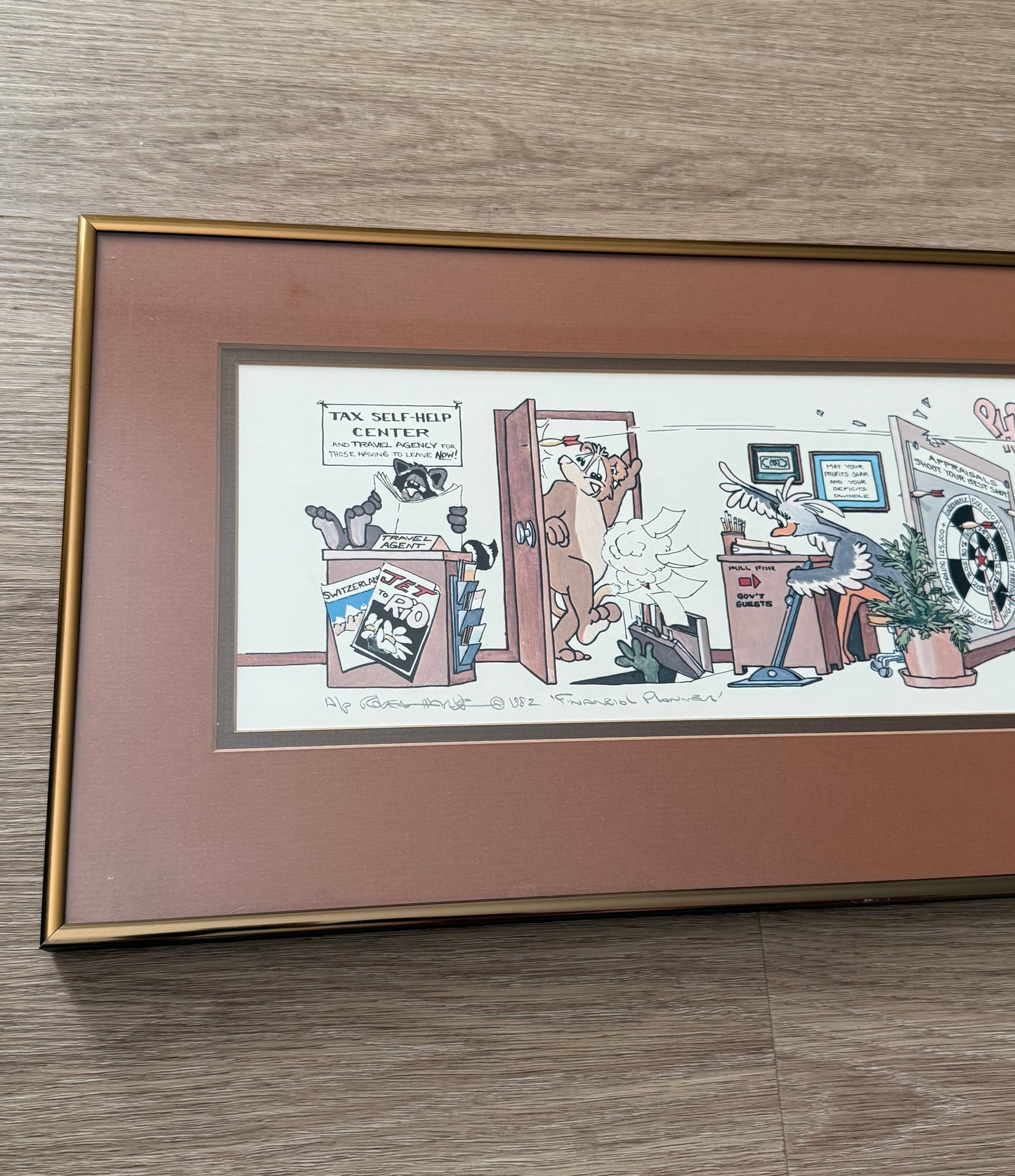 Vintage Framed Cartoon Artwork is titled “Financial Planners”, Signed and Numbered by Robert Marble in 1982 - 50/750