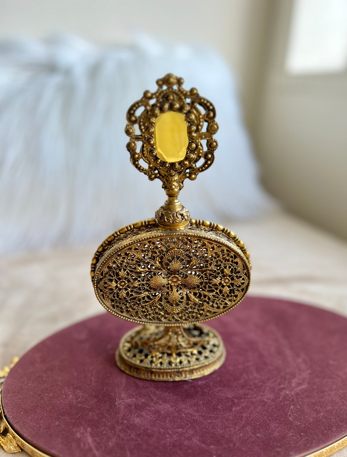 1950s or 1960s Hollywood Regency Style Vintage Ormolu Filigree Gilded Brass Perfume Bottle with a Large Yellow Rhinestone on the Top