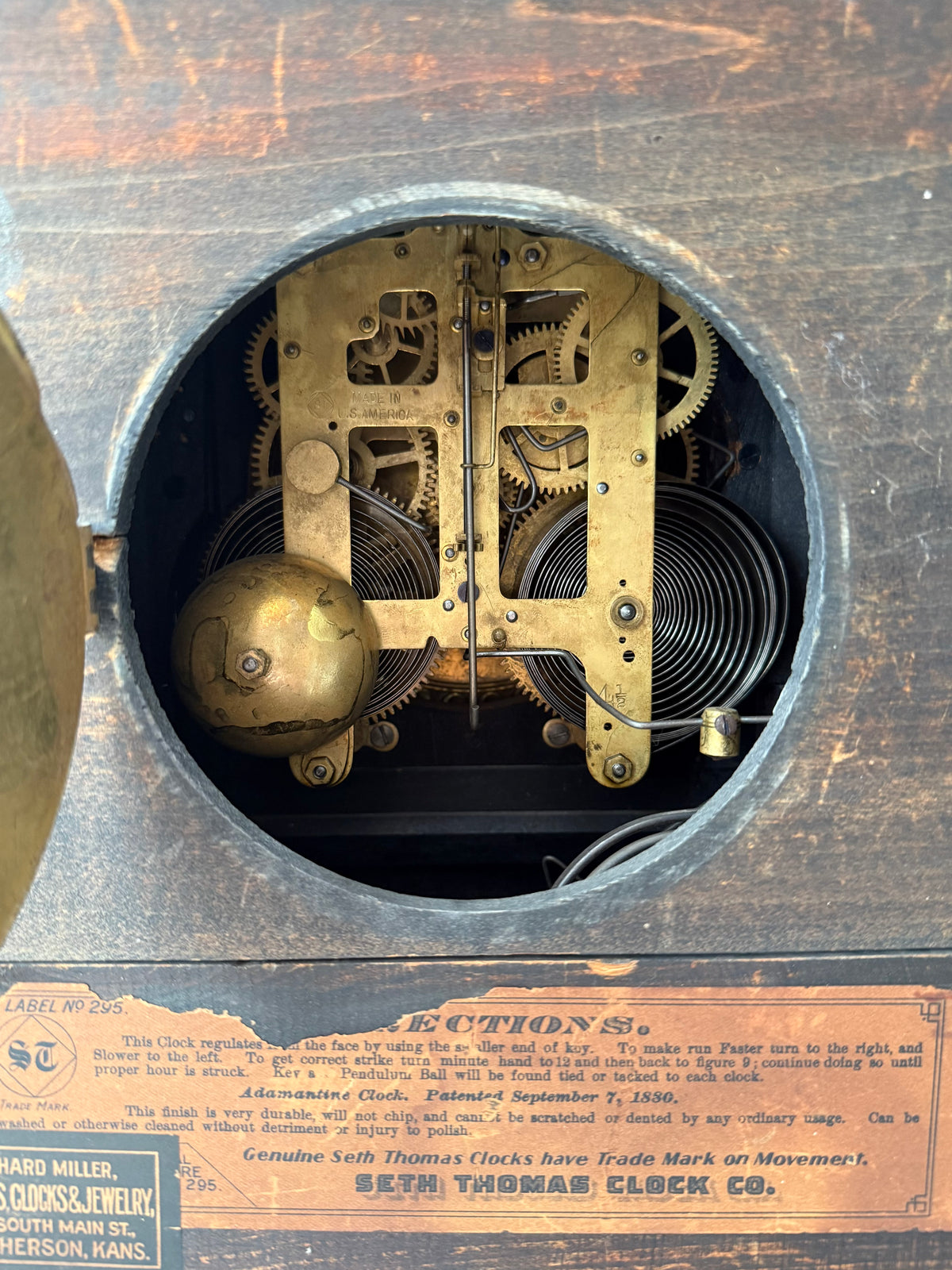 Antique Adamantine Seth Thomas Wooden Mantel Clock from the Late 19th or Early 20th Century with Lion Heads - Working